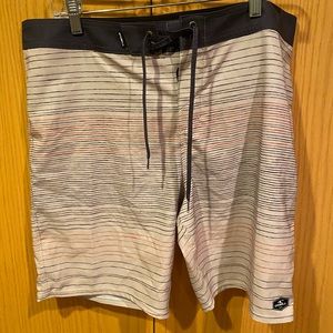 O’Neill - Men’s Size 34 Hyperfreak board shorts - Tan with Red and Blue stripes